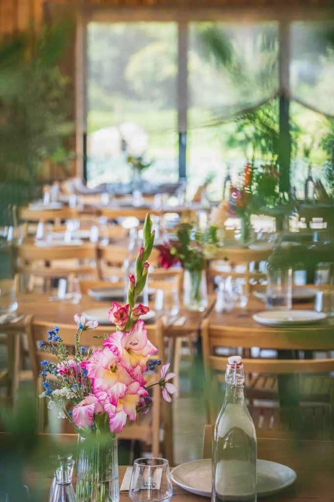 Groobarbs Field Kitchen Portrait table setting looking though to the bifolding doors